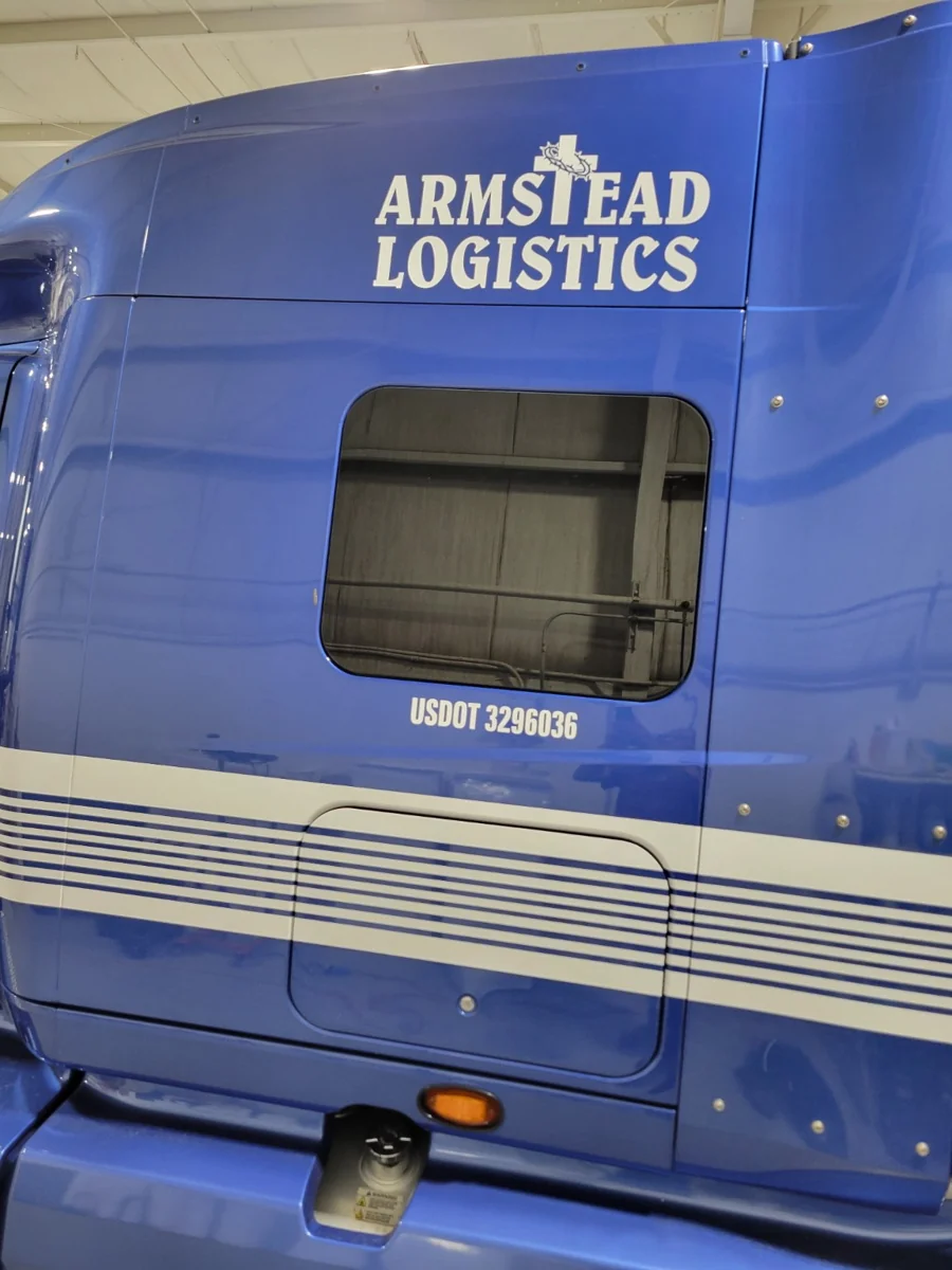 Blue Armstead Logistics truck with company lettering