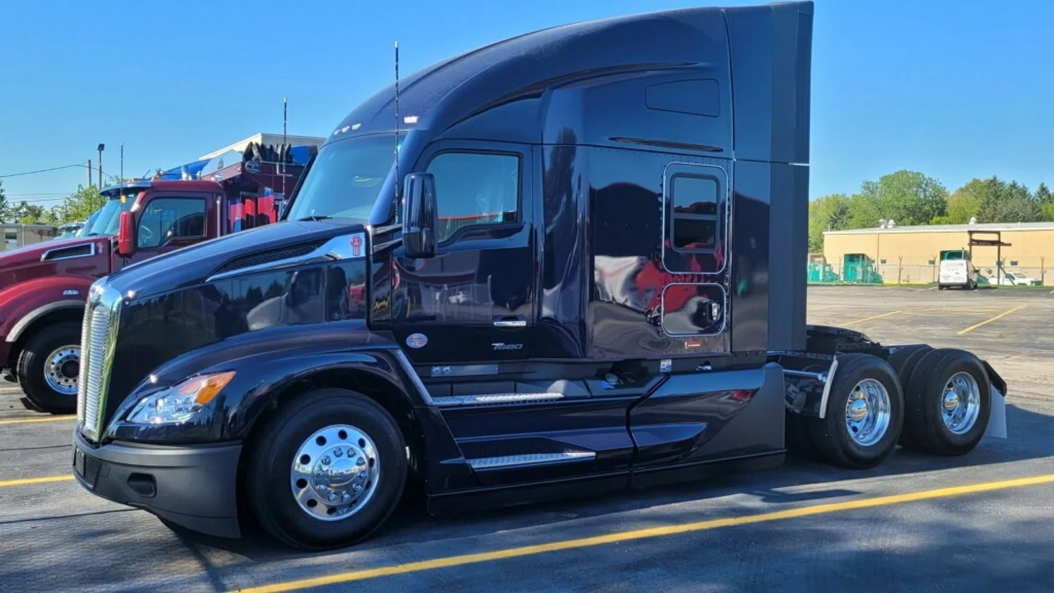 Black semi truck in company fleet